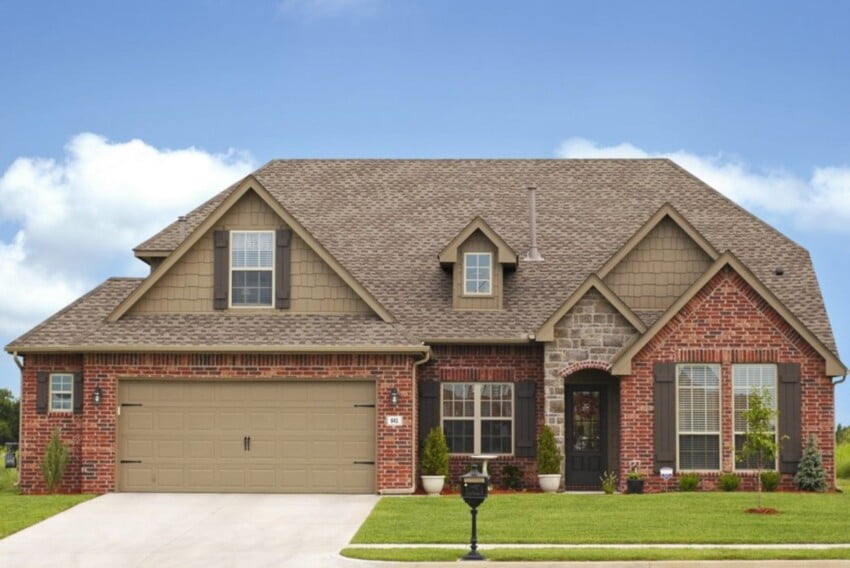 Brown Shingles On Red Brick House